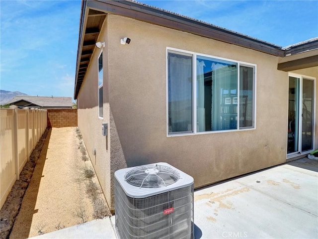 11576 S Crescent St, Desert Hot Springs, CA 92240 - view of property exterior with stucco siding, a fenced backyard, and a patio