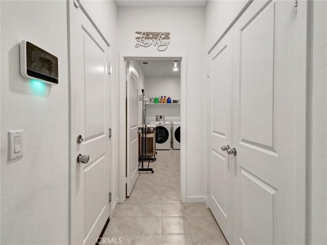 11576 S Crescent St, Desert Hot Springs, CA 92240 - hallway with washing machine and dryer and light tile patterned flooring