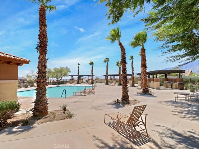 11576 S Crescent St, Desert Hot Springs, CA 92240 - community pool with a patio area