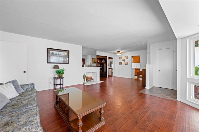 9802 Swallow Ln, Garden Grove, CA 92841 - living room with wood finished floors, ceiling fan, and a fireplace with flush hearth