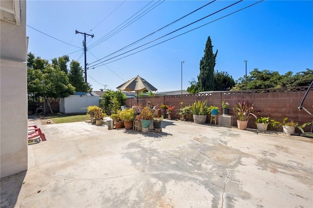 9802 Swallow Ln, Garden Grove, CA 92841 - fenced backyard with a patio area and a storage unit