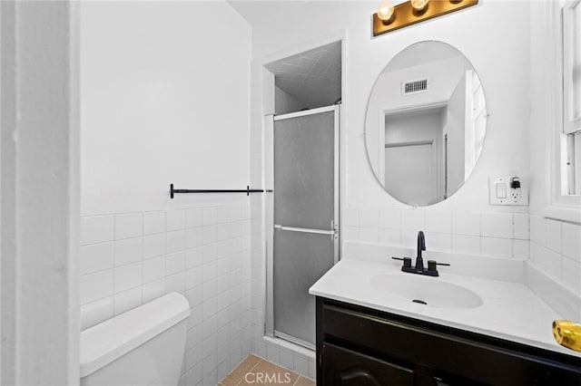 9802 Swallow Ln, Garden Grove, CA 92841 - bathroom with tile walls, vanity, a shower stall, and wainscoting