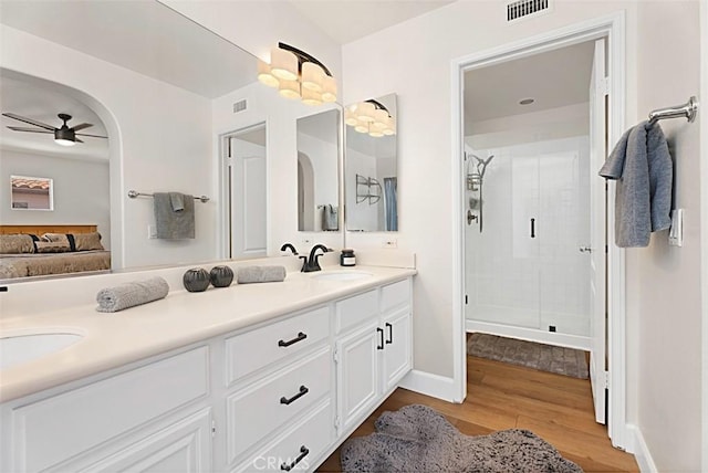 35 Colony Way, Aliso Viejo, CA 92656 - full bath with double vanity, wood finished floors, a shower stall, ceiling fan, and connected bathroom