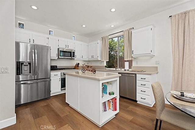 35 Colony Way, Aliso Viejo, CA 92656 - kitchen featuring appliances with stainless steel finishes, white cabinetry, dark wood-style flooring, recessed lighting, and light countertops