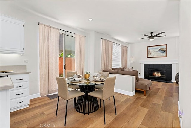35 Colony Way, Aliso Viejo, CA 92656 - dining area featuring light wood finished floors, a ceiling fan, a fireplace, and recessed lighting
