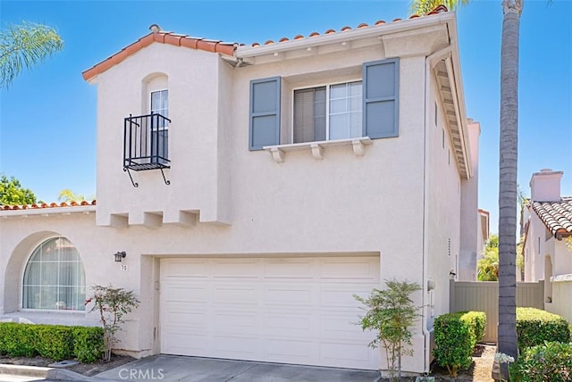 35 Colony Way, Aliso Viejo, CA 92656 - mediterranean / spanish-style house featuring stucco siding, an attached garage, a tile roof, and concrete driveway