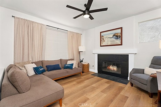35 Colony Way, Aliso Viejo, CA 92656 - living room with light wood-type flooring, a ceiling fan, and a tiled fireplace