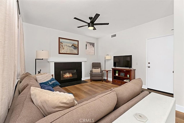 35 Colony Way, Aliso Viejo, CA 92656 - living room featuring wood finished floors, a ceiling fan, and a tiled fireplace