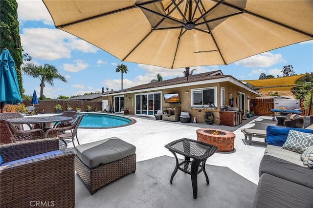 1935 Adobe Ave, Corona, CA 92882 - view of swimming pool featuring a fenced backyard, a patio area, and an outdoor living space with a fire pit