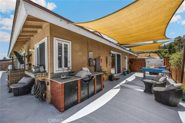 1935 Adobe Ave, Corona, CA 92882 - fenced backyard featuring a patio, area for grilling, a storage shed, and a bar
