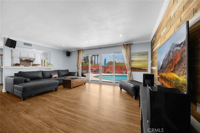 1935 Adobe Ave, Corona, CA 92882 - living room featuring ornamental molding, wood finished floors, and recessed lighting