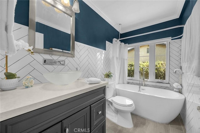 1935 Adobe Ave, Corona, CA 92882 - bathroom with ornamental molding, a soaking tub, vanity, tile walls, and wood finished floors