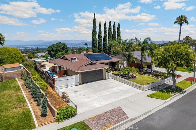 1935 Adobe Ave, Corona, CA 92882 - view of front of property with a mountain view, concrete driveway, an attached garage, and a gate