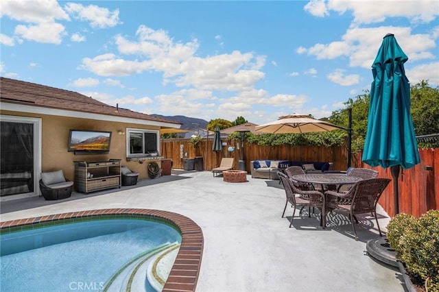 1935 Adobe Ave, Corona, CA 92882 - view of swimming pool with a fenced backyard, a patio, and an outdoor living space with a fire pit