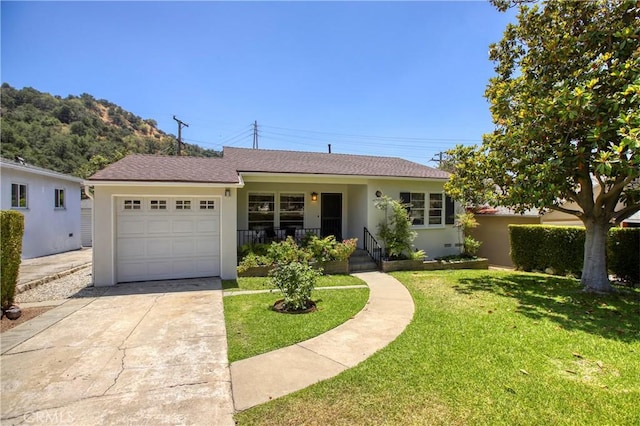 1852 Alpha Rd, Glendale, CA 91208 - ranch-style home with a garage, concrete driveway, stucco siding, a front yard, and roof with shingles