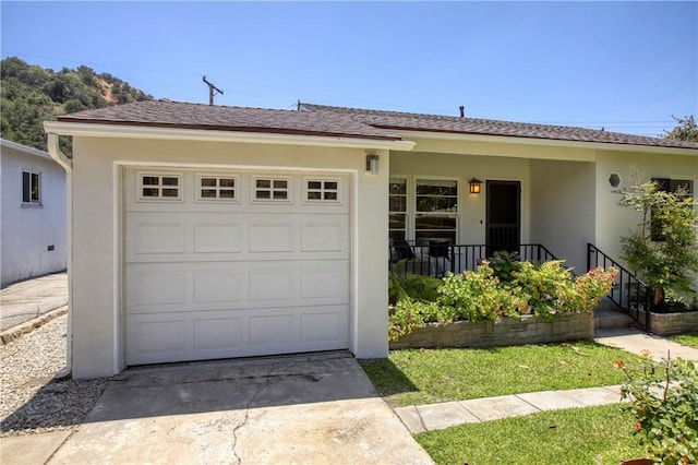 1852 Alpha Rd, Glendale, CA 91208 - ranch-style home featuring stucco siding, concrete driveway, a garage, and covered porch