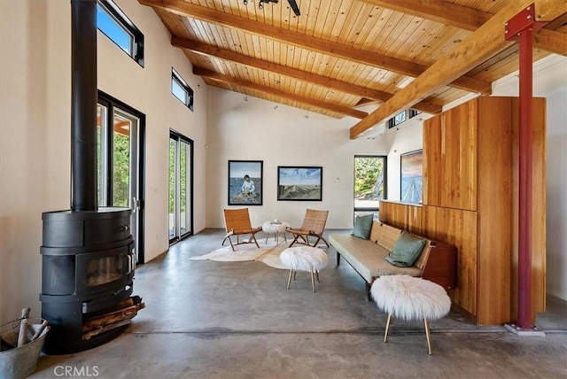 4190 Shadow Canyon Rd, Templeton, CA 93465 - living area with a wooden ceiling with exposed beams, finished concrete floors, a wood stove, and high vaulted ceiling
