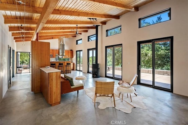 4190 Shadow Canyon Rd, Templeton, CA 93465 - living room featuring a wood ceiling with exposed beams, finished concrete flooring, healthy amount of natural light, and a high ceiling