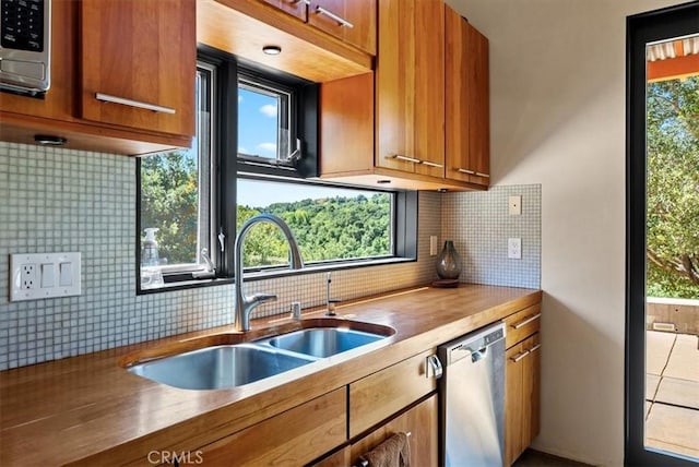 4190 Shadow Canyon Rd, Templeton, CA 93465 - kitchen with appliances with stainless steel finishes, backsplash, and brown cabinetry