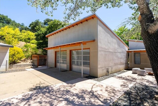 4190 Shadow Canyon Rd, Templeton, CA 93465 - back of house with a patio, a detached garage, and stucco siding