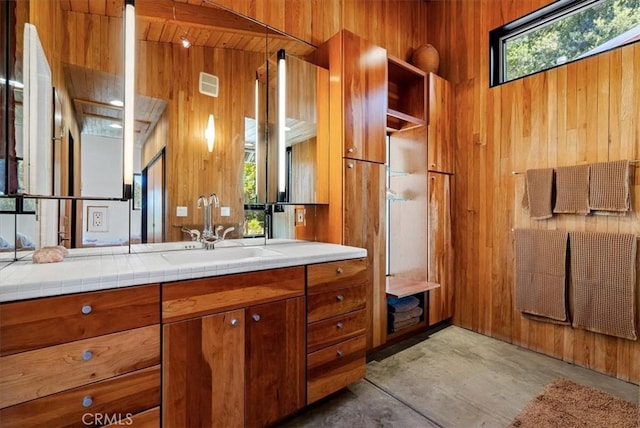 4190 Shadow Canyon Rd, Templeton, CA 93465 - bathroom featuring wooden walls, vanity, and concrete floors