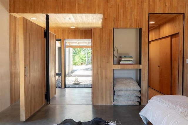 4190 Shadow Canyon Rd, Templeton, CA 93465 - bedroom featuring wooden walls, concrete floors, and access to exterior