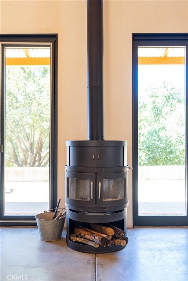 4190 Shadow Canyon Rd, Templeton, CA 93465 - detailed view of finished concrete flooring and a wood stove