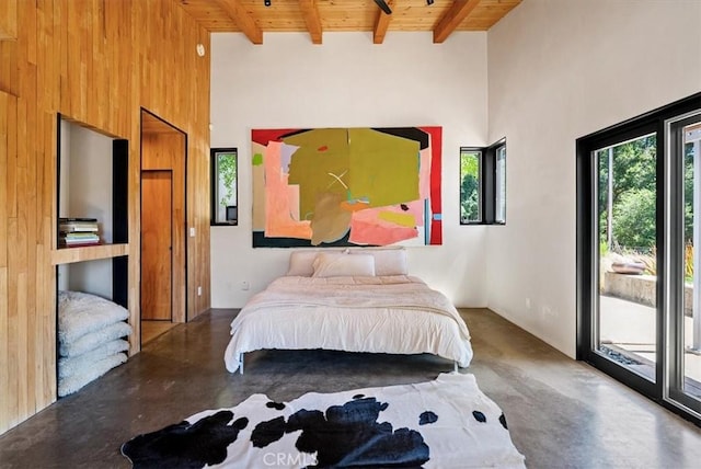 4190 Shadow Canyon Rd, Templeton, CA 93465 - bedroom with a wood ceiling with exposed beams, access to exterior, concrete floors, a high ceiling, and wooden walls