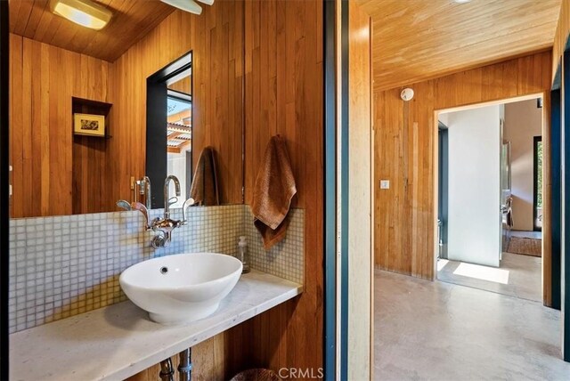 4190 Shadow Canyon Rd, Templeton, CA 93465 - bathroom featuring tasteful backsplash, wooden walls, wood ceiling, and concrete flooring