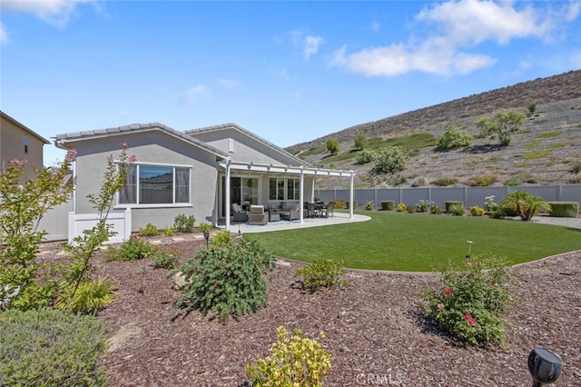 28816 Sedge Ln, Saugus, CA 91350 - rear view of property with a fenced backyard, a patio, stucco siding, and a mountain view