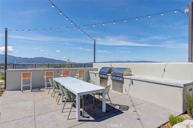 28816 Sedge Ln, Saugus, CA 91350 - view of patio with an outdoor kitchen, a mountain view, and outdoor dining area