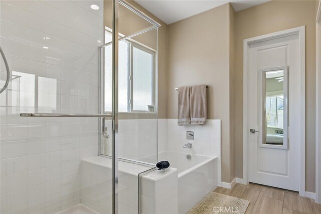 28816 Sedge Ln, Saugus, CA 91350 - full bath featuring a shower stall, a garden tub, and wood finished floors
