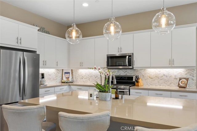 28816 Sedge Ln, Saugus, CA 91350 - kitchen featuring stainless steel appliances, white cabinetry, and recessed lighting