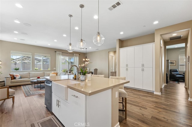 28816 Sedge Ln, Saugus, CA 91350 - kitchen featuring dishwasher, wood finished floors, hanging light fixtures, open floor plan, and healthy amount of natural light