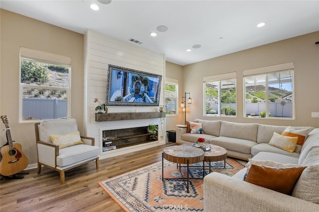 28816 Sedge Ln, Saugus, CA 91350 - living area featuring wood finished floors, recessed lighting, and a large fireplace
