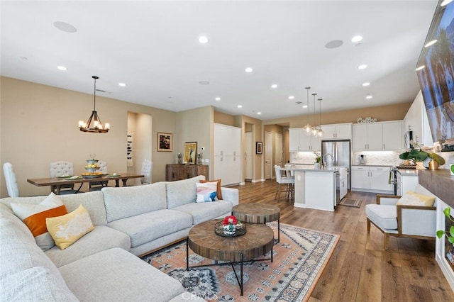 28816 Sedge Ln, Saugus, CA 91350 - living room featuring a chandelier, recessed lighting, and wood finished floors