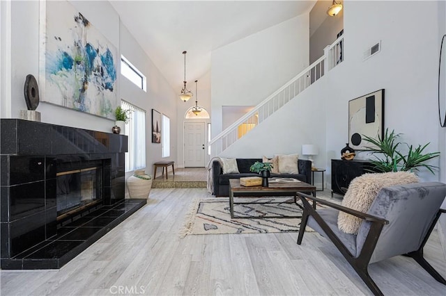15775 Caminito Atico, San Diego, CA 92128 - living room with stairway, high vaulted ceiling, and wood finished floors