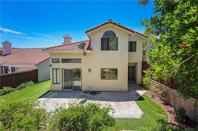 15775 Caminito Atico, San Diego, CA 92128 - rear view of house featuring stucco siding, a tiled roof, a fenced backyard, and a patio area