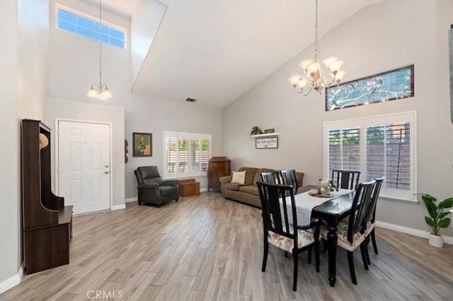 27242 Cabrillo Dr, Menifee, CA 92586 - dining space featuring a chandelier, high vaulted ceiling, and light wood-style floors