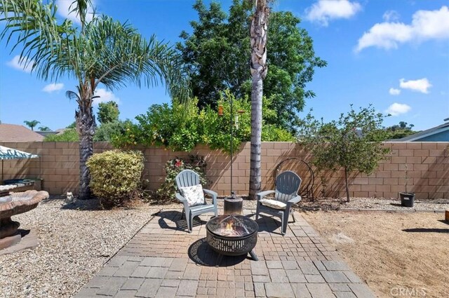 27242 Cabrillo Dr, Menifee, CA 92586 - view of patio featuring a fire pit