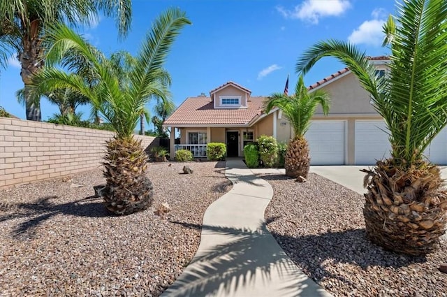 27242 Cabrillo Dr, Menifee, CA 92586 - mediterranean / spanish house featuring a tile roof, a garage, driveway, and stucco siding