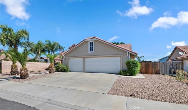 27242 Cabrillo Dr, Menifee, CA 92586 - view of front facade with driveway, stucco siding, a tile roof, and a garage