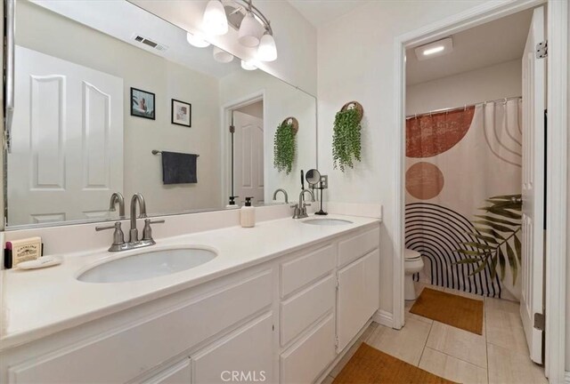 27242 Cabrillo Dr, Menifee, CA 92586 - bathroom with double vanity, tile patterned flooring, and a shower with shower curtain