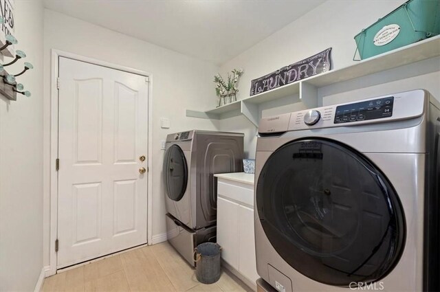 27242 Cabrillo Dr, Menifee, CA 92586 - laundry room with independent washer and dryer and baseboards