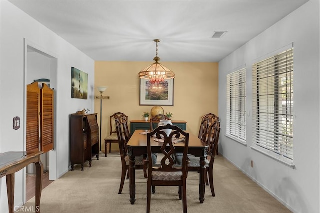 181 Eucalyptus Rd, Nipomo, CA 93444 - dining room with a chandelier, plenty of natural light, and light carpet