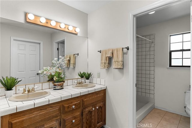 181 Eucalyptus Rd, Nipomo, CA 93444 - bathroom with double vanity, tile patterned flooring, and tiled shower