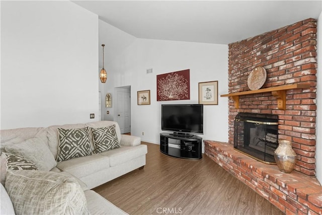 181 Eucalyptus Rd, Nipomo, CA 93444 - living area featuring wood finished floors, a brick fireplace, and high vaulted ceiling