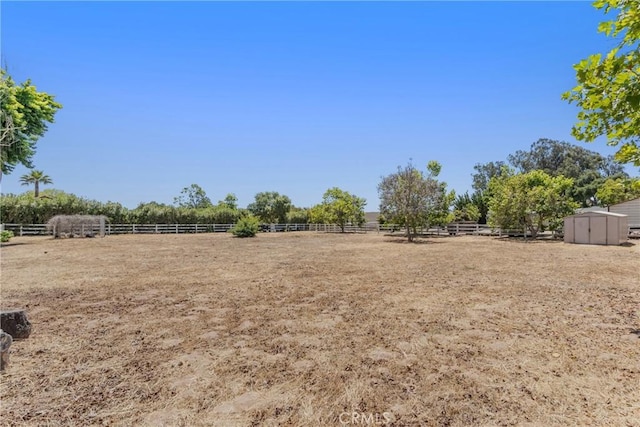 181 Eucalyptus Rd, Nipomo, CA 93444 - view of yard with an outdoor riding arena, a storage shed, and a view of rural / pastoral area