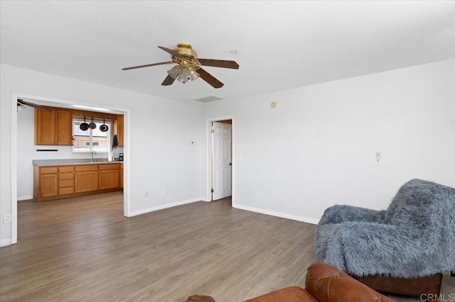 28880 Mac Tan Rd, Valley Center, CA 92082 - sitting room with ceiling fan and wood finished floors