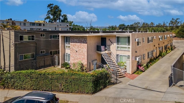 6045 Hazelhurst Pl, North Hollywood, CA 91606 - view of apartment building / complex featuring stairway